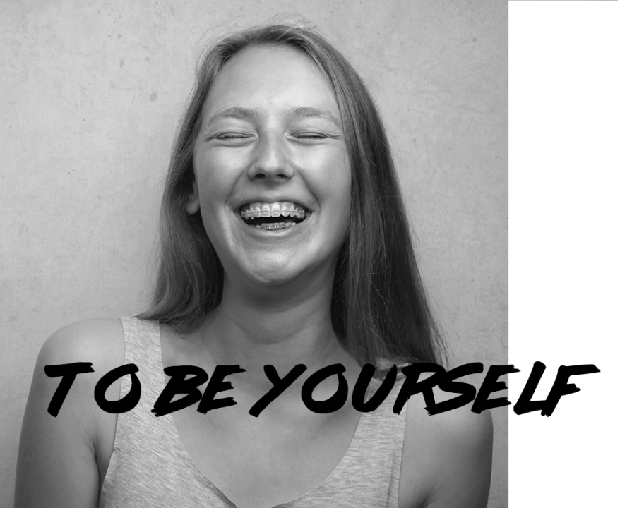 a photo of a young woman with braces laughing with the to be yourself logo