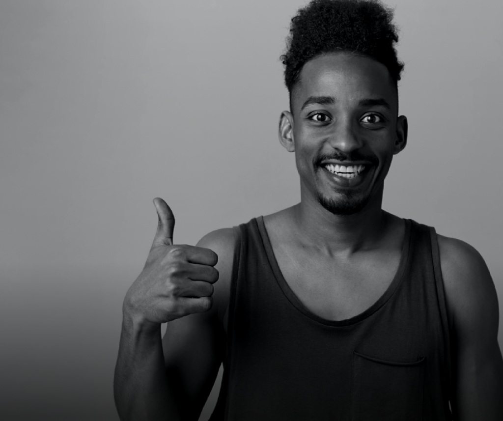 a photo of a young man giving a thumbs up